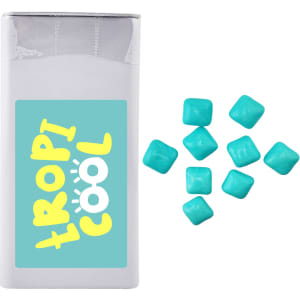 A rectangular package of mints in white, with several turquoise square mints scattered beside it. The package has a logo.