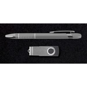 A silver pen and a silver USB drive, presented on a dark textured background, includes branding elements.