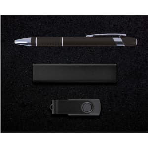 A black pen, a black USB drive, and a black holder, arranged on a dark textured background.