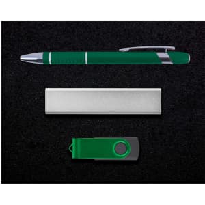 A green pen, silver business card holder, and green USB flash drive on a dark background.