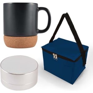 A coffee mug with a cork base, a round portable speaker, and a navy blue insulated bag.