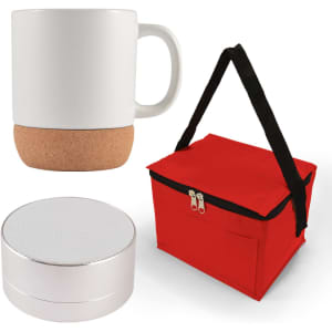 An espresso coffee mug with a cork bottom, a compact silver speaker, and a red carrying bag are displayed together.