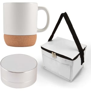 A coffee mug with a cork base, a small speaker, and a white carrying case with a black strap.