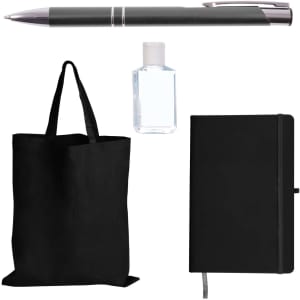 A black tote bag, a black notebook, a clear hand sanitizer bottle, and a silver pen. All items are part of a tradeshow pack.