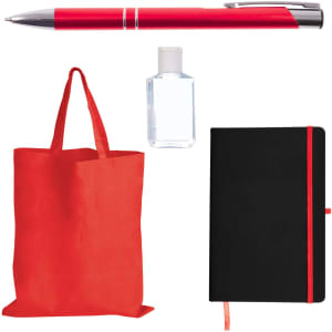 A red pen, a clear hand sanitizer bottle, a red tote bag, and a black notebook with a red elastic band.