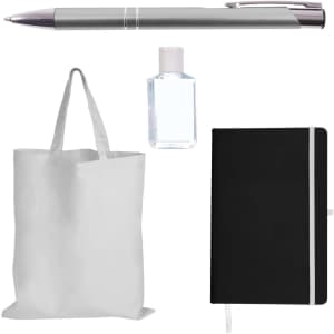 A silver pen, a clear hand sanitizer bottle, a black notebook with an elastic band, and a plain white tote bag.