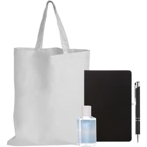 A reusable tote bag, a bottle of hand sanitizer, a black notebook, and a pen.
