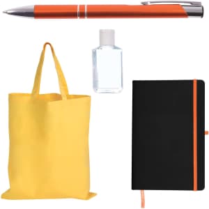 A pen with an orange accent, a small bottle, a yellow tote bag, and a black notebook with an orange elastic band.