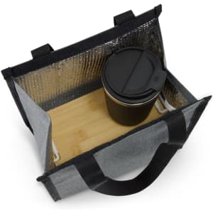 A grey cooler bag with a bamboo base and a black drink bottle inside. The bag has an insulated interior and sturdy handles.