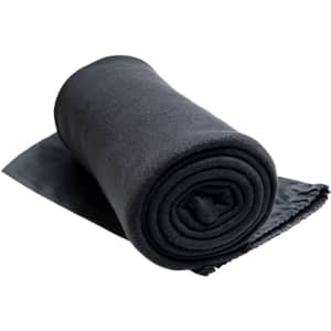 A rolled black Polar Blanket, designed for leisure and outdoor use.