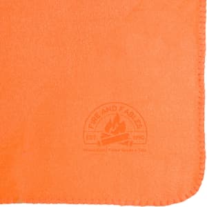 An orange fleece blanket featuring a logo in the corner. The fabric appears soft and warm.