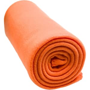 An orange polar blanket, rolled neatly, made from soft fabric.
