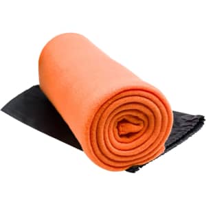 A rolled-up orange Polar Blanket with a black fabric backing.