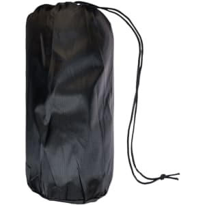 A black polar blanket packed in a portable storage bag with a drawstring closure.