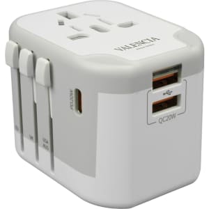 A white travel adapter with multiple plug options, featuring USB ports and a logo.