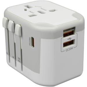 A white travel power adapter with multiple plug options and USB ports for charging devices.
