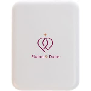 A white rectangular product featuring a logo in the centre with pink and gold accents.