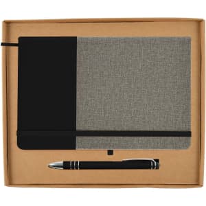 A gift set featuring a grey and black notebook and a black pen, packaged in a simple cardboard box.