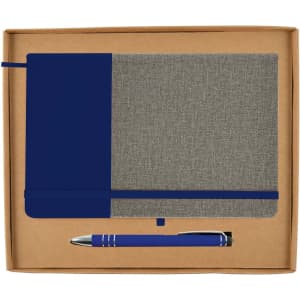 A navy and gray notebook paired with a silver pen, presented in a kraft gift box.