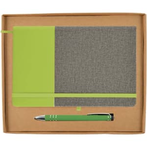 A notebook with a gray and green design and a matching green pen, presented in a cardboard gift box.