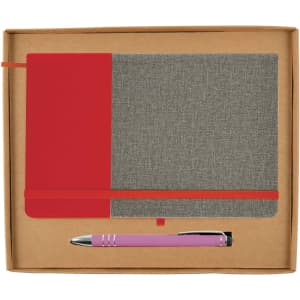 A grey notebook with a red cover and a pink pen, packaged in a brown gift box.