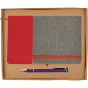A cardboard gift set featuring a grey and red notebook with an elastic closure and a purple pen.