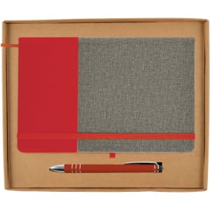 A notebook with a red and gray cover alongside a matching pen, presented in a cardboard gift set.