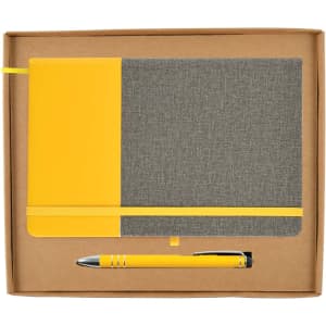 A gray and yellow notebook with an elastic band and a matching yellow pen, presented in a cardboard gift box.