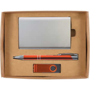 A gift set including a metallic cardholder, an orange pen, and a USB flash drive, all presented in a cardboard box.