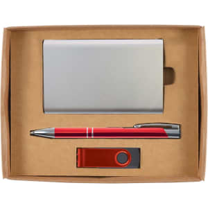 A sleek metallic cardholder, a red pen, and a red USB flash drive are neatly arranged in a craft cardboard gift box.