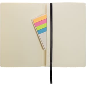 A recycled leather notebook in cream color with a black ribbon bookmark and colorful sticky notes inside.