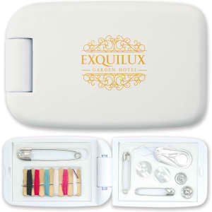 A white sewing kit with threads in various colours, buttons, safety pins, and a needle, featuring a logo on the lid.