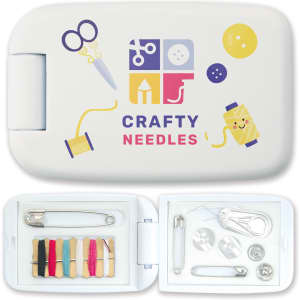 A white sewing kit with colorful graphics, containing threads, needles, buttons, scissors, and safety pins.