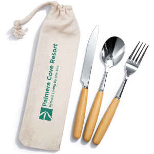 A cutlery set with stainless steel knife, fork, and spoon featuring wooden handles, packed in a fabric pouch with a logo.