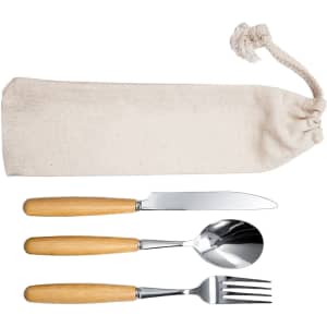 A cutlery set featuring a knife, spoon, and fork with wooden handles, stored in a natural fabric pouch.