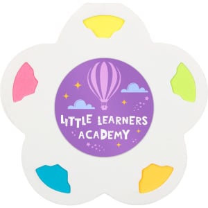 A floral-shaped set of sticky notes featuring vibrant colours: pink, yellow, green, and blue, with a central logo.