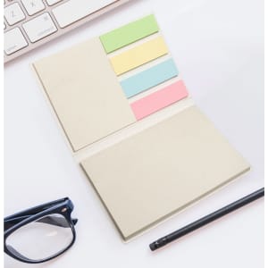 A sticky note booklet featuring various colored sticky notes in a compact design, accompanied by a pen and glasses.