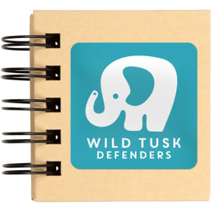 A tan sticky note pad with a spiral binding featuring an elephant logo on a turquoise background.