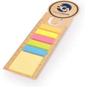 A bamboo bookmark featuring a ruler, with five colourful sticky notes in yellow, pink, green, blue, and orange.