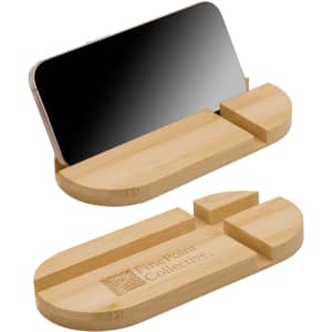 A bamboo phone stand with a sleek design, featuring a small logo and a slot for holding a mobile device.
