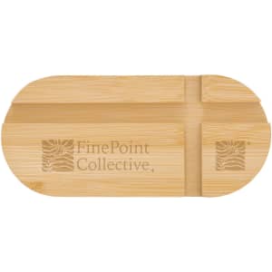 A bamboo phone stand featuring an engraved logo, with a smooth, natural finish and an oval shape.
