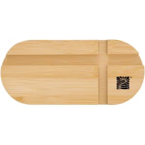 A bamboo phone stand featuring a simple, oval design and a branded logo on the side.