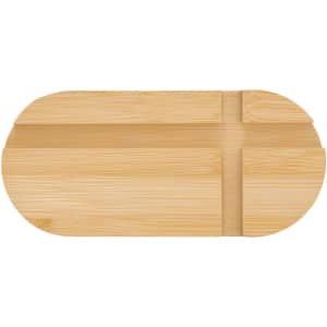 A bamboo phone stand in a smooth, natural finish with an oval shape and two grooves for support.