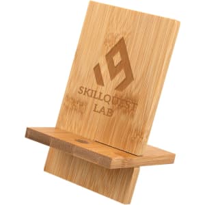 A bamboo phone stand featuring a simple design with a logo, in natural wood tones.