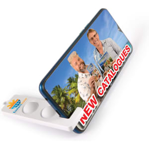 A phone stand in white and blue, displaying an image of two people against a tropical backdrop.