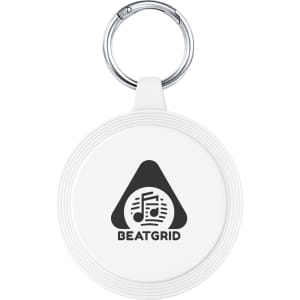 A white keychain with a circular design and a silver keyring, featuring a logo with musical notes.