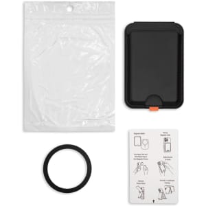 A black phone wallet with a plastic protective sleeve, a black ring, and an instruction card.