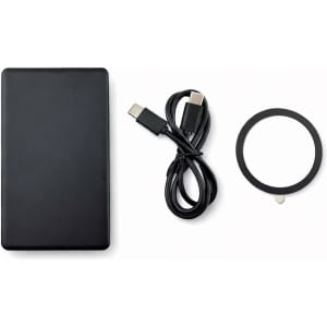 A black solid state power bank, a USB-C cable, and a circular accessory. The product features a logo.