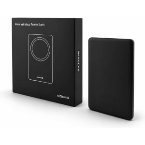 A black power bank next to its box, featuring a wireless charging area and a logo.