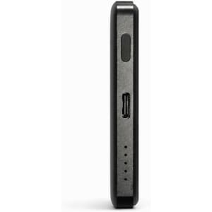 A sleek black solid state power bank with a slim profile and ports on one side, featuring a branding logo.